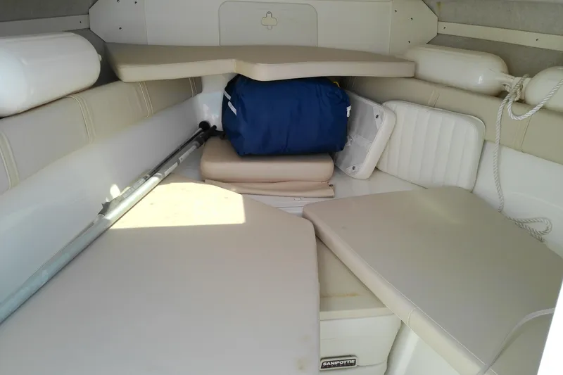 Slide: The Image of Interior cabin of a 2009 Key West 2020 Walkaround boat with seating and storage. - 16