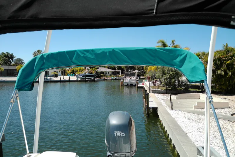 Slide: The Image of Boat view from Key West 2020 Walkaround, 2009 model, docked in a sunny marina. - 19