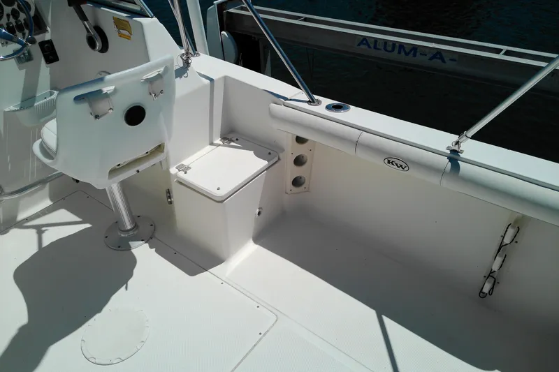 Slide: The Image of Interior of a 2009 Key West 2020 Walkaround boat, featuring seating and storage. - 21