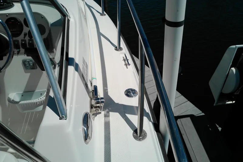 Slide: The Image of Key West 2020 Walkaround boat deck and controls, docked at marina, 2009 model. - 23