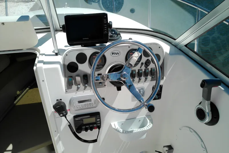 Slide: The Image of Steering console of a 2009 Key West 2020 Walkaround boat with navigation equipment. - 5