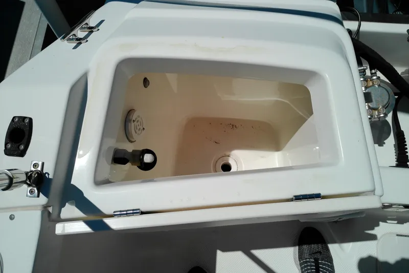 Slide: The Image of Open storage compartment on a 2009 Key West 2020 Walkaround boat. - 7