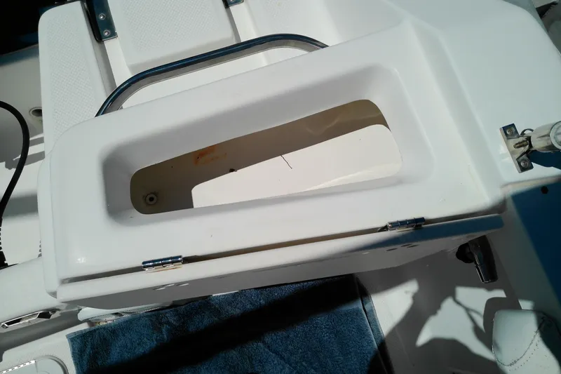 Slide: The Image of Open storage compartment on a 2009 Key West 2020 Walkaround boat. - 8