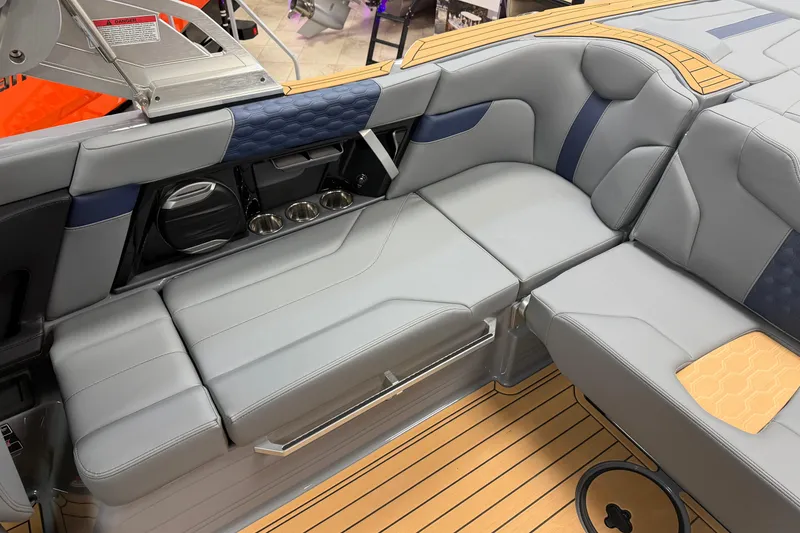 Slide: The Image of 2026 MasterCraft XT22 boat interior with gray seating and teak flooring. - 11