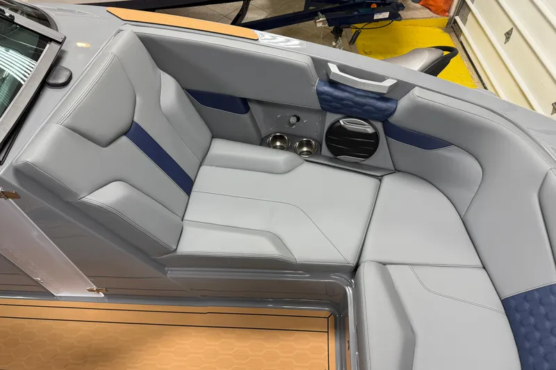 Slide: The Image of Interior of 2026 MasterCraft XT22 boat with gray and blue seating. - 16