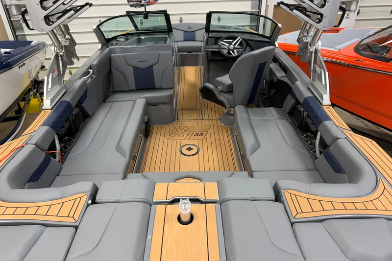 Slide: The Image of 2026 MasterCraft XT22 boat interior with sleek gray seating and modern design. - 3