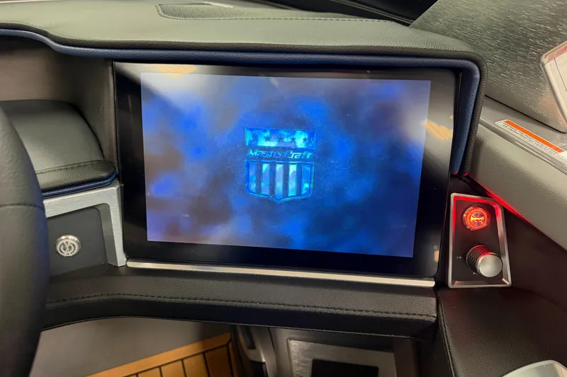 Slide: The Image of 2026 MasterCraft XT22 dashboard with digital display and control panel. - 7