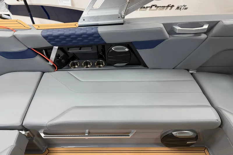 Slide: The Image of 2026 MasterCraft XT22 boat interior with sleek gray seating and modern design elements. - 9