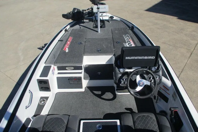 Slide: The Image of 2016 Triton 179 TrX boat interior with Humminbird electronics and Mercury branding. - 2