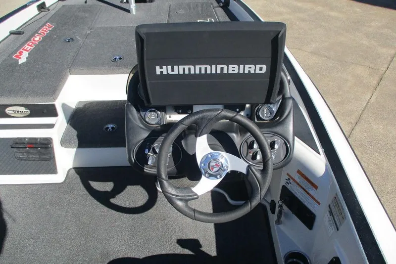 Slide: The Image of 2016 Triton 179 TrX boat dashboard with Humminbird display and steering wheel. - 5