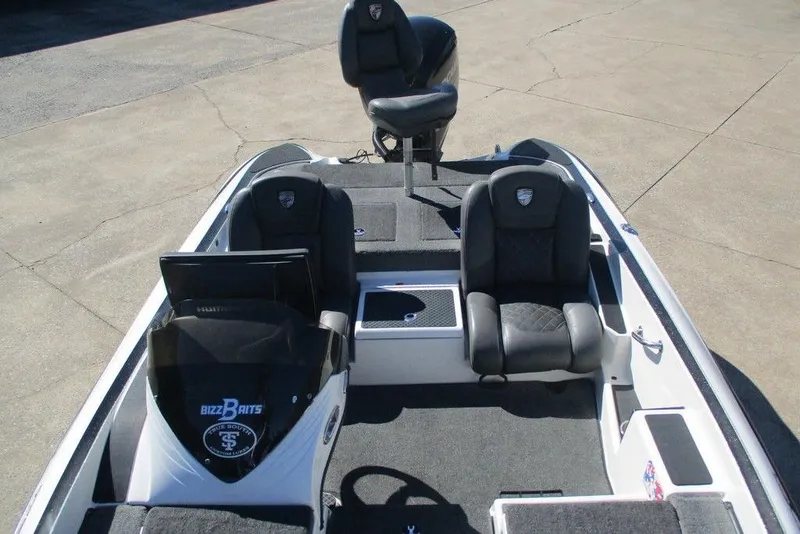 Slide: The Image of 2016 Triton 179 TrX boat interior with dual seats and steering console. - 7