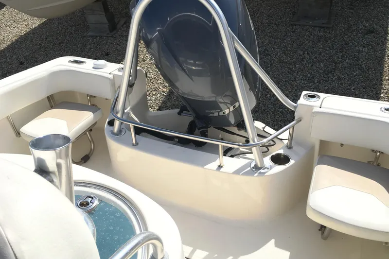 Slide: The Image of 2014 Pioneer 222 Sportfish boat interior with Yamaha outboard motor. - 10
