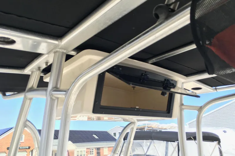 Slide: The Image of 2014 Pioneer 222 Sportfish boat T-top with open storage compartment. - 5