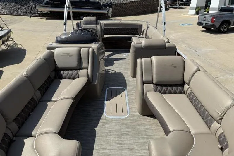 Slide: The Image of 2020 Bennington 25 QSBIO pontoon boat with luxurious beige seating and spacious layout. - 10