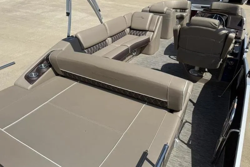 Slide: The Image of 2020 Bennington 25 QSBIO pontoon boat interior with luxurious seating and helm. - 13