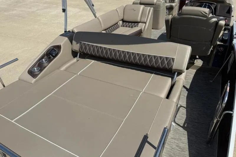 Slide: The Image of 2020 Bennington 25 QSBIO boat interior with luxurious seating and cup holders. - 14