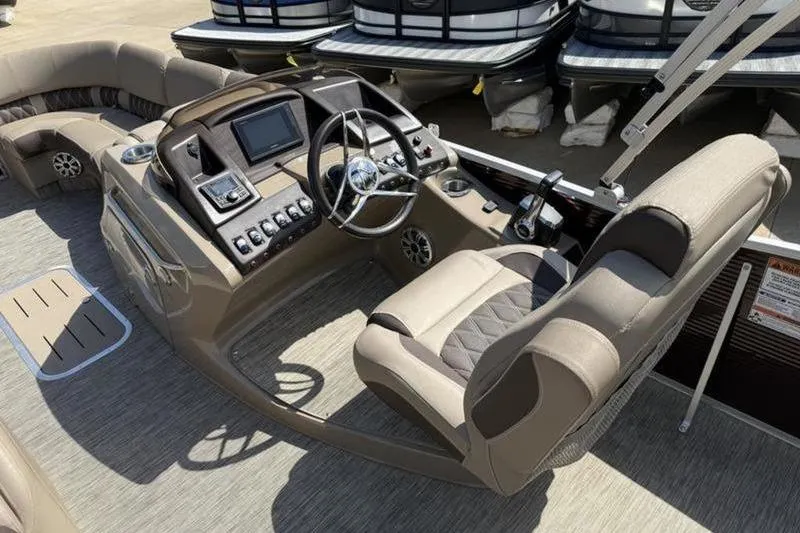 Slide: The Image of 2020 Bennington 25 QSBIO boat interior with modern helm and comfortable seating. - 15