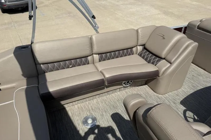 Slide: The Image of 2020 Bennington 25 QSBIO boat interior with beige and brown seating. - 16
