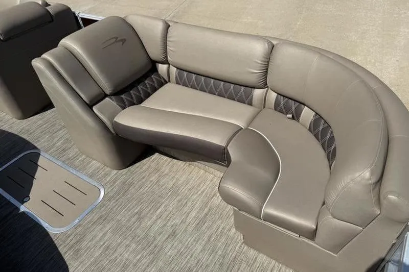 Slide: The Image of 2020 Bennington 25 QSBIO boat interior with luxurious beige seating and diamond-pattern accents. - 19