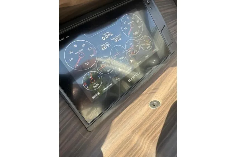 Slide: The Image of Garmin display on 2020 Bennington 25 QSBIO boat dashboard showing various gauges and metrics. - 7