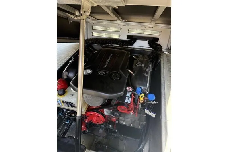 Slide: The Image of Engine compartment of a 2020 Bennington 25 QSBIO boat, showcasing mechanical components. - 8