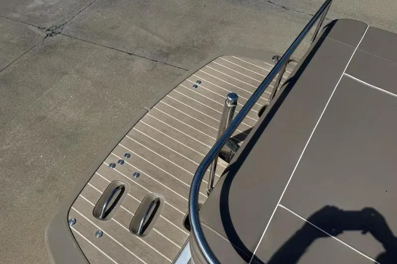 Slide: The Image of 2020 Bennington 25 QSBIO boat deck with stainless steel railing and textured flooring. - 9