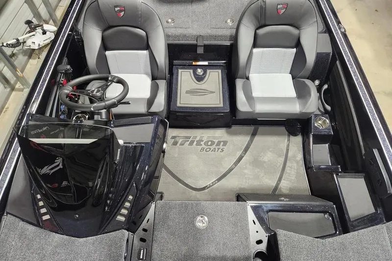 Slide: The Image of 2026 Triton 20XP Patriot boat interior with dual seats and steering wheel. - 10