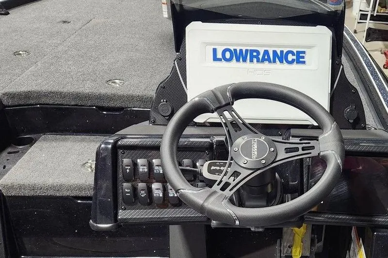 Slide: The Image of Steering wheel and dashboard of 2026 Triton 20XP Patriot boat with Lowrance display. - 5