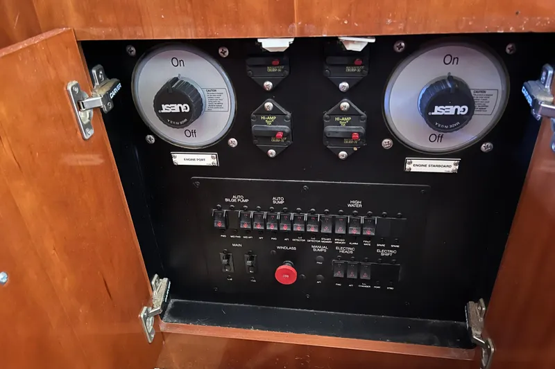Slide: The Image of Electrical control panel inside a 2004 Carver 444 Cockpit Motor Yacht. - 16
