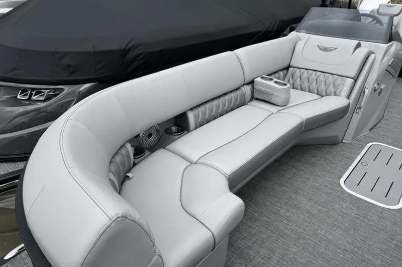 Slide: The Image of Luxurious seating on 2025 Bennington 26 LXSSB pontoon boat, featuring elegant gray upholstery. - 12
