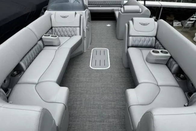 Slide: The Image of Luxurious interior of 2025 Bennington 26 LXSSB pontoon boat with plush seating and cup holders. - 5