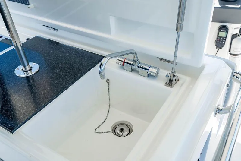 Slide: The Image of 2024 Aquila 44 Yacht sink with modern faucet and sleek design. - 103