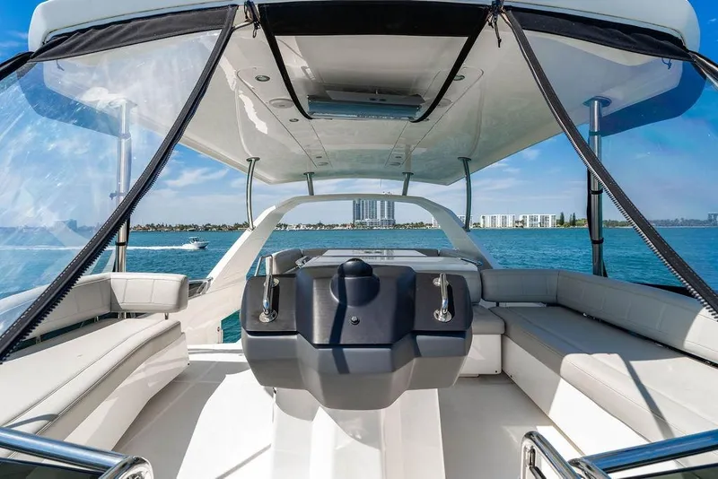 Slide: The Image of 2024 Aquila 44 Yacht interior with panoramic ocean view and modern seating. - 106