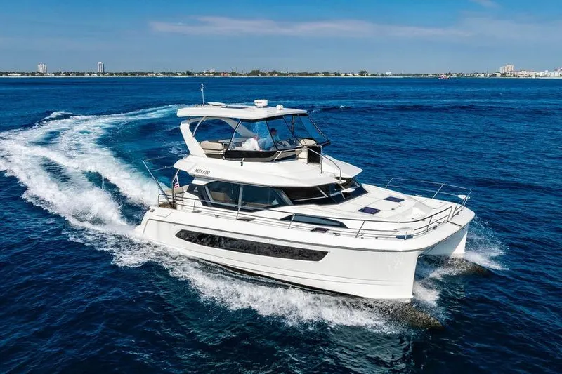 Slide: The Image of 2024 Aquila 44 Yacht cruising on open blue waters. - 17