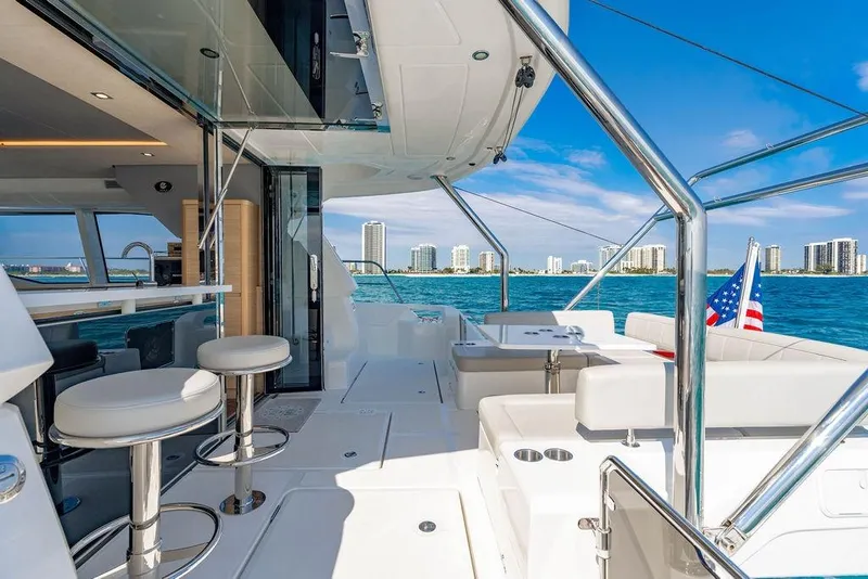 Slide: The Image of Luxurious 2024 Aquila 44 Yacht interior with ocean view and modern seating. - 38