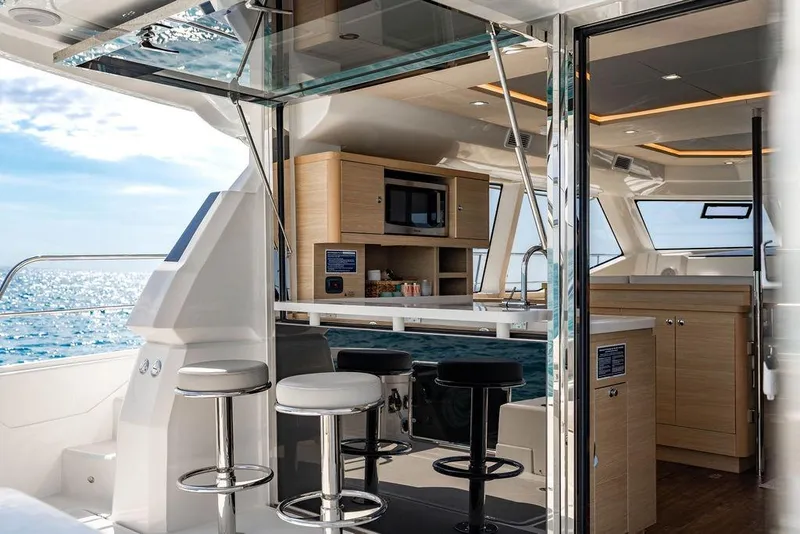 Slide: The Image of Luxurious interior of 2024 Aquila 44 Yacht with modern kitchen and ocean view. - 43