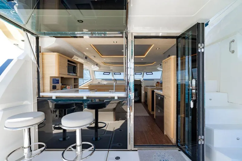 Slide: The Image of Luxurious interior of 2024 Aquila 44 Yacht with modern kitchen and seating area. - 44