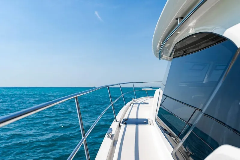 Slide: The Image of 2024 Aquila 44 Yacht cruising on clear blue ocean waters. - 46