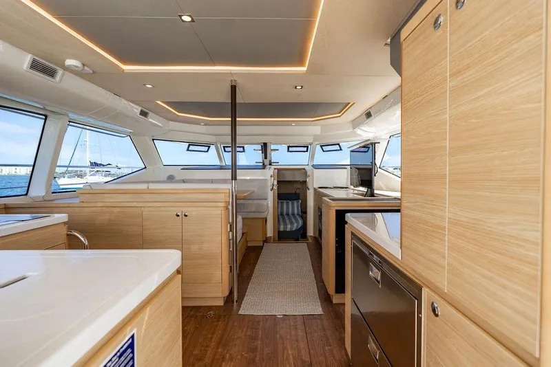 Slide: The Image of Luxurious interior of 2024 Aquila 44 Yacht with modern wood finishes and ample natural light. - 52