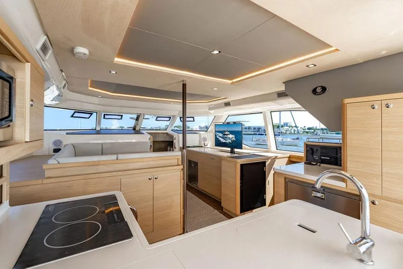 Slide: The Image of Luxurious interior of 2024 Aquila 44 Yacht with modern kitchen and panoramic windows. - 53