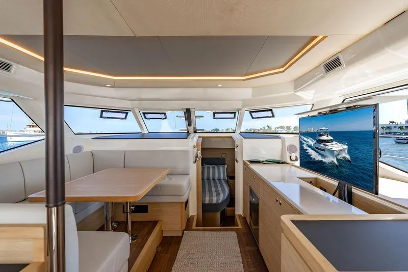 Slide: The Image of Luxurious interior of 2024 Aquila 44 Yacht with modern seating and large windows. - 54