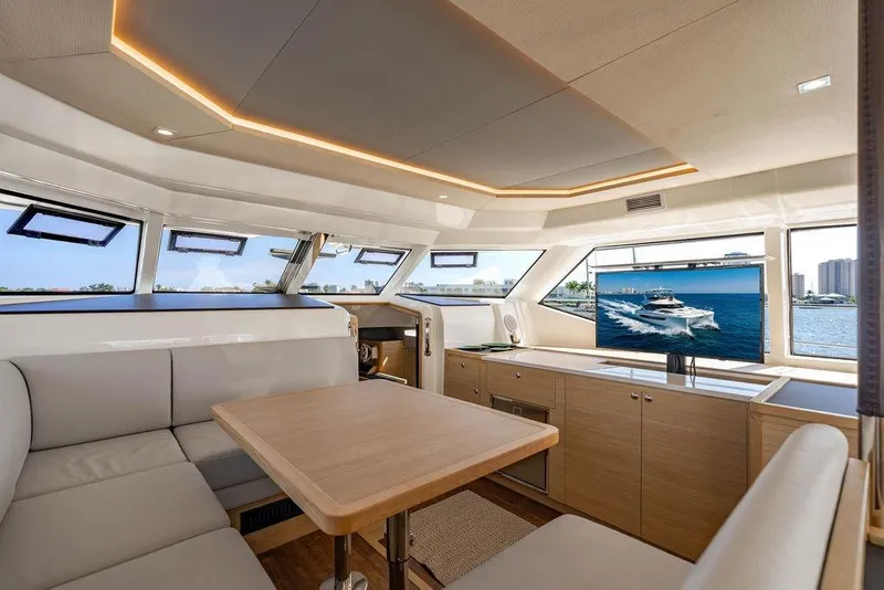 Slide: The Image of Luxurious interior of 2024 Aquila 44 Yacht with modern seating and panoramic windows. - 55