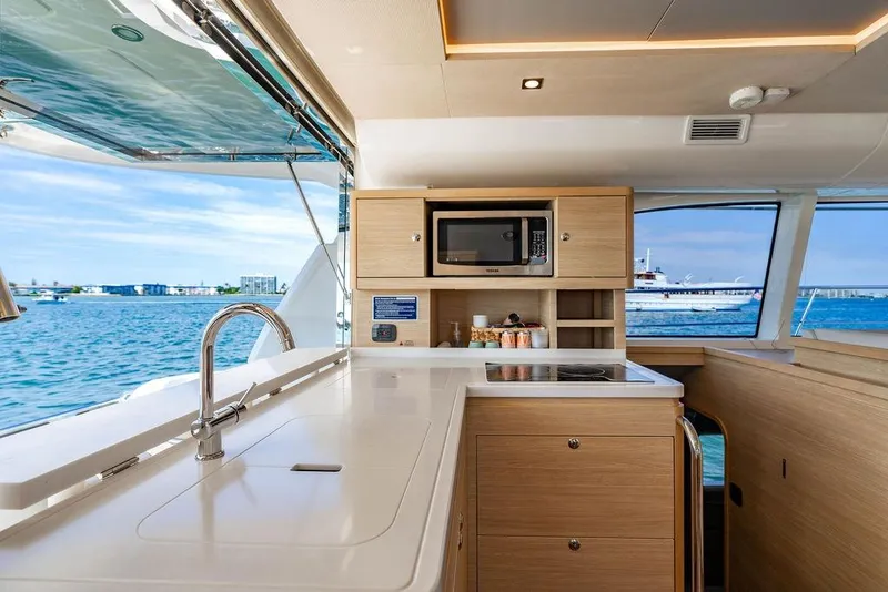 Slide: The Image of Interior of 2024 Aquila 44 Yacht featuring modern kitchen with ocean view. - 56