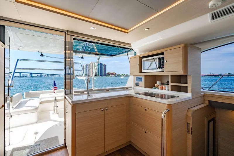 Slide: The Image of Luxurious interior of 2024 Aquila 44 Yacht with modern kitchen and scenic ocean view. - 57