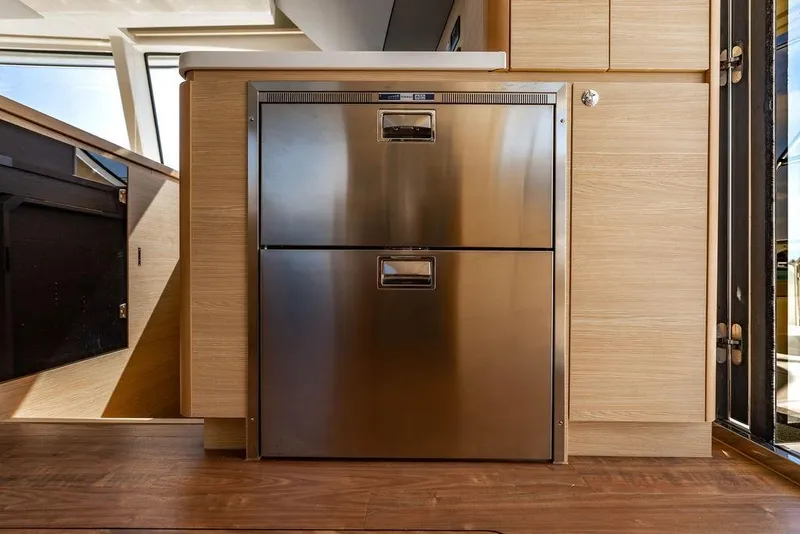 Slide: The Image of Stainless steel refrigerator in 2024 Aquila 44 Yacht interior kitchen. - 59