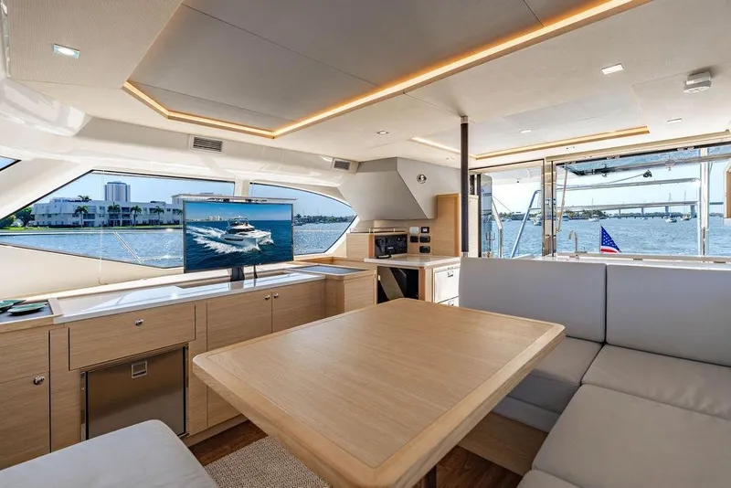 Slide: The Image of Luxurious interior of 2024 Aquila 44 Yacht with modern furnishings and scenic water views. - 62