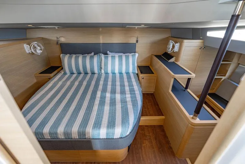 Slide: The Image of Luxurious cabin interior of 2024 Aquila 44 Yacht with striped bedding. - 64