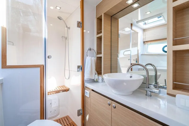 Slide: The Image of Luxurious bathroom interior of 2024 Aquila 44 Yacht with modern fixtures and wooden accents. - 71