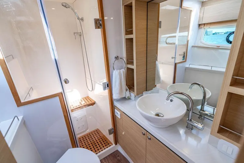 Slide: The Image of Luxurious bathroom in 2024 Aquila 44 Yacht with modern fixtures and wooden accents. - 72
