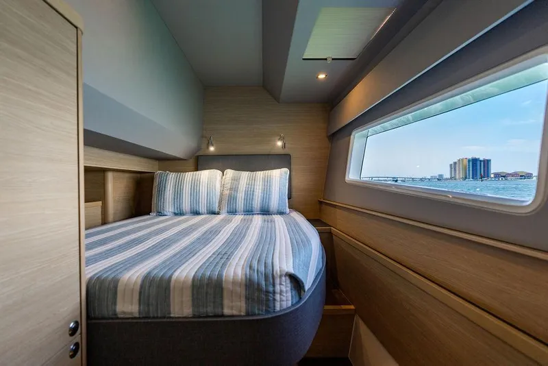 Slide: The Image of Luxurious bedroom interior of 2024 Aquila 44 Yacht with ocean view window. - 75